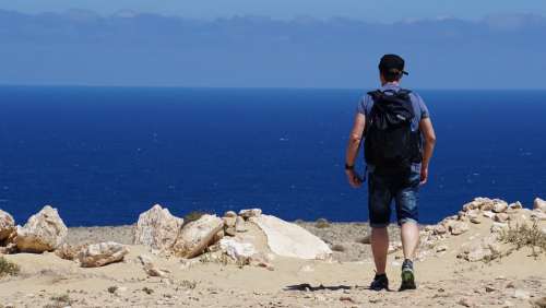 Man Hiking Backpack Sea Ocean Blue Rock