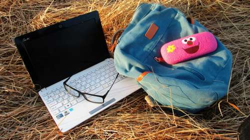 Notebook Glasses Backpack Still Life Composition