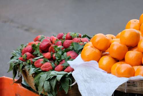 Strawberries and Oranges for Sale in Baskets