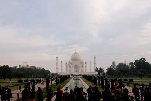 Tourists Taking Photos in Front of Taj Mahal