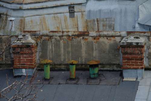 Old Chimneys on a Building Rooftop
