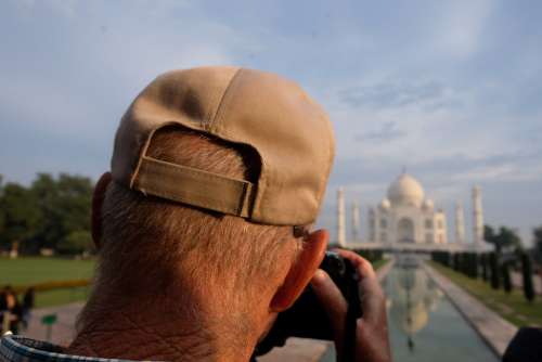 Man Taking Photos of Taj Mahal