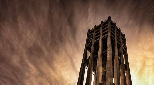 Haunting View Of Bell Tower Framed By West Coast Sunset Photo