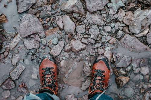 Rugged Hiking Boots Stood On Rocks Photo