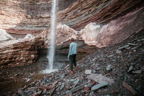 Waterfall Crashes At The Bottom Of A Rockface Photo