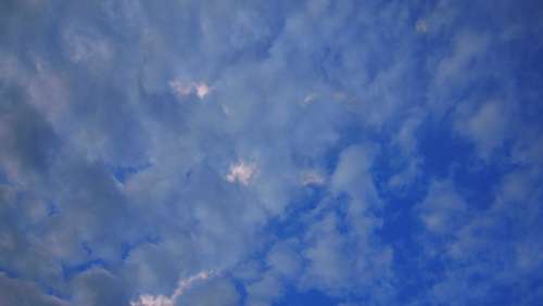 sky blue sky clouds sun through clouds view