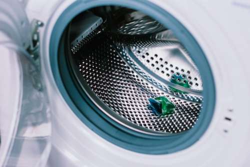 Laundry detergent pod inside a washing machine