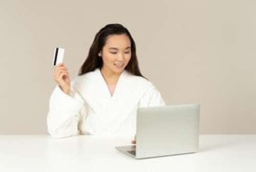 Smiling Young Asian Woman Doin Online Shopping