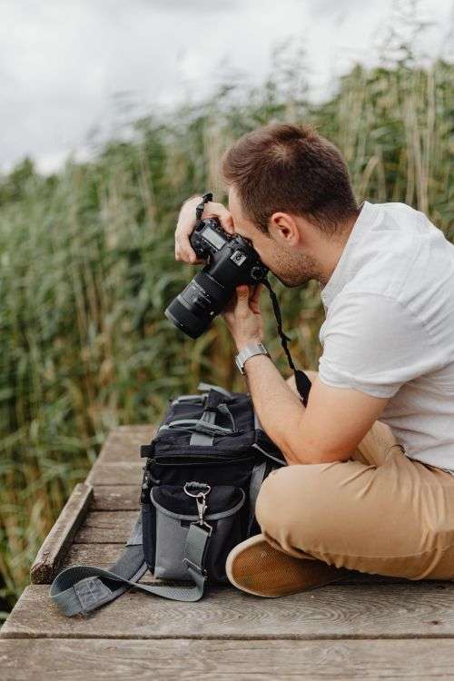 Photographer holding a DSLR camera