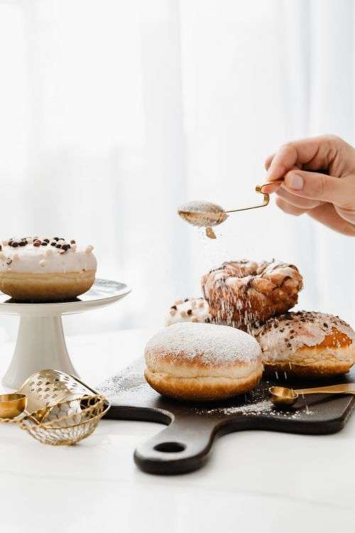 Polish Paczki Donut with Powdered Sugar