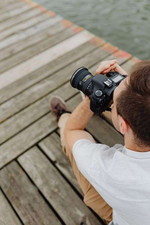 Photographer holding a DSLR camera