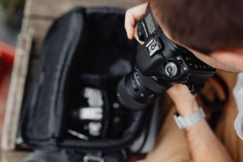 Photographer holding a DSLR camera