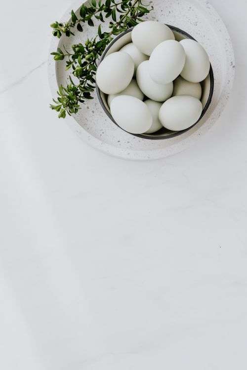 Easter flat lay with eggs on a white marble