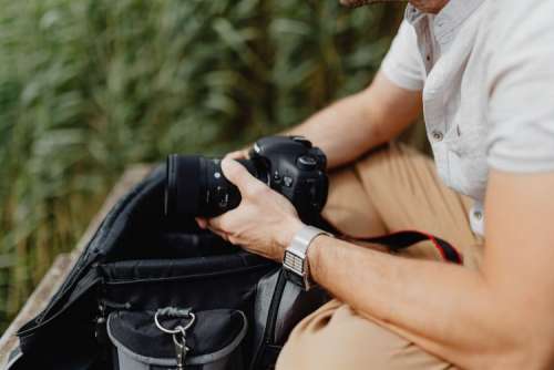 Photographer holding a DSLR camera