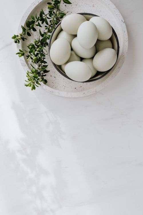 Easter flat lay with eggs on a white marble