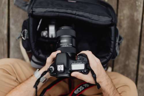 Photographer holding a DSLR camera