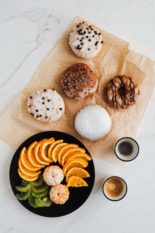 Donuts & Pączki with fruit and coffee