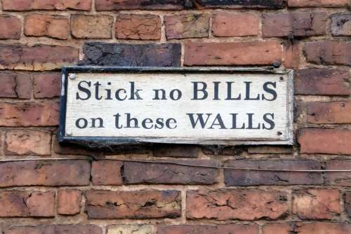 sign wall brick bill notice