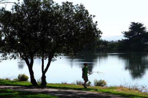 lake boy walking water tree