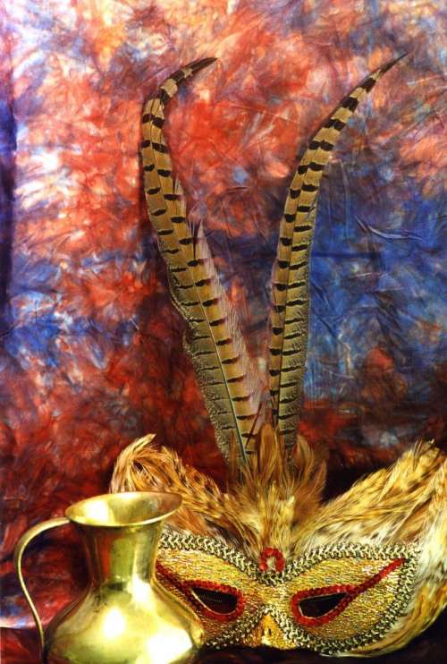 mask feathers pot gold tie-dye