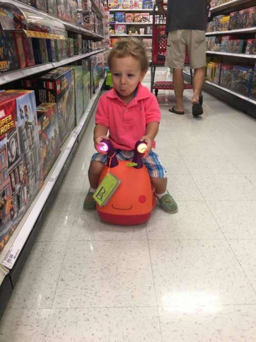 toddler ride on toy toys little boy pink shirt