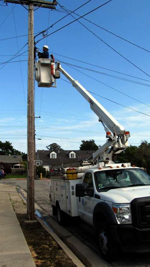 Lineman cherry picker telephone pole utility pole phone repair
