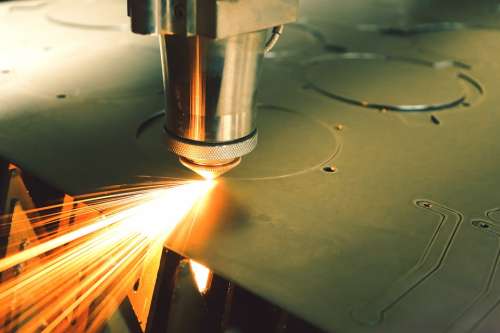 Laser Machine Laser Cuts Metal Spark Production