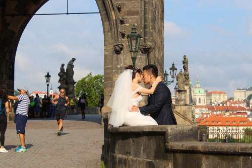 Prague Charles Bridge Bride And Groom Kiss