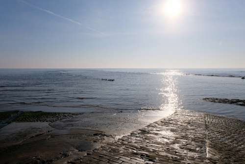 Slipway Sea Cobbles Sunlight Reflection Water
