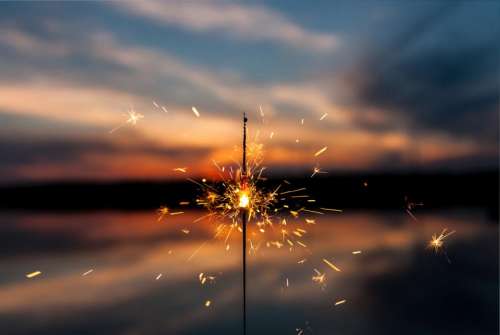 sparkler lights fire dark night