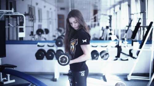 girl gym weights muscles working out