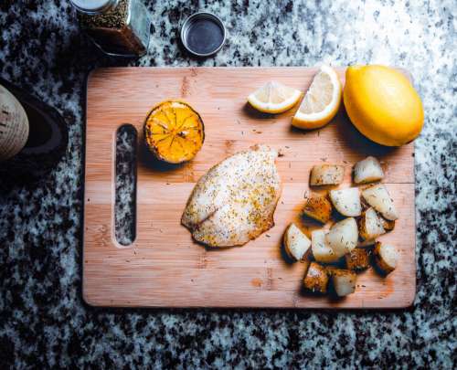 fish lemon chopping board cooking food