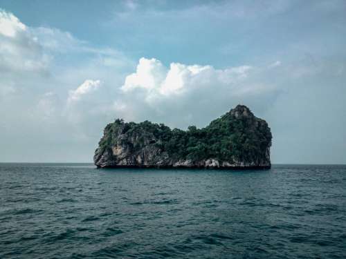 island cliffs rocks water ocean