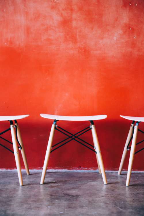 modern stools cafe chairs red wall