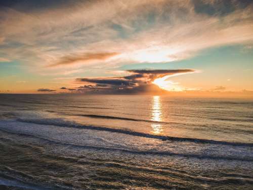 ocean sunset clouds waves water