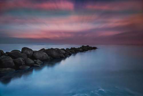 ocean sea water rocks dusk