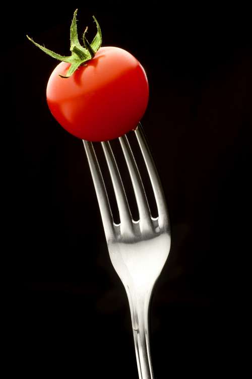 tomato fork red black background