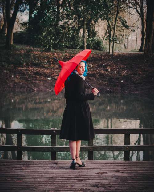 woman red umbrella black dress dress