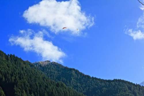 nature mountain trees sky parachute