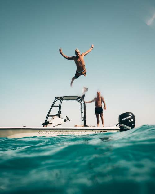 man jumping sea swim summer