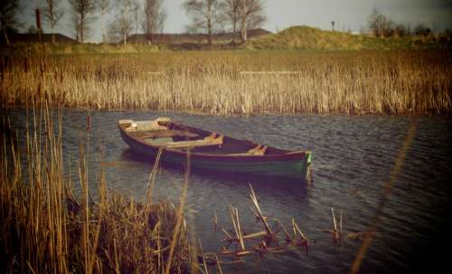 boat lake water reeds fields