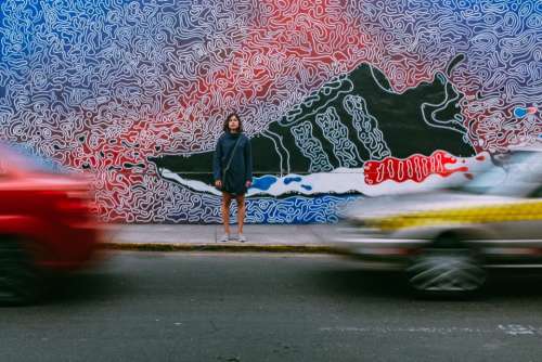 people woman street road wall