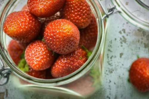 red fruit strawberry glass jar