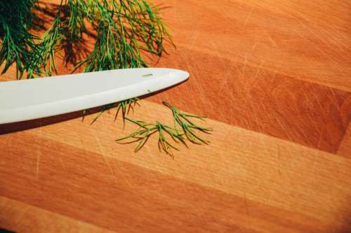 dill herbs knife cutting board kitchen