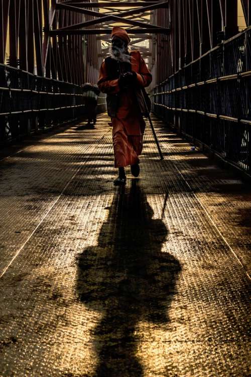 people man structure bridge shadow