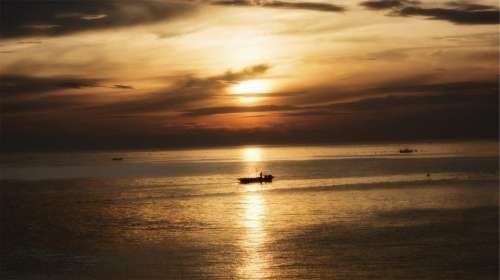 sunset boats ships ocean sea