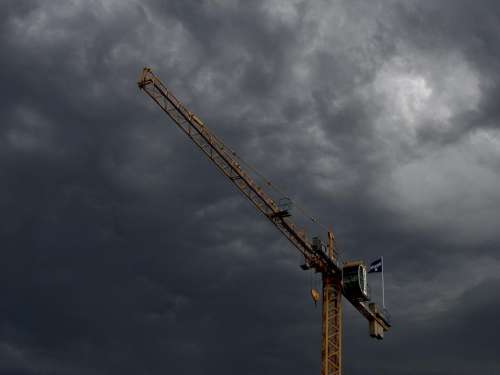 crane construction industrial sky storm