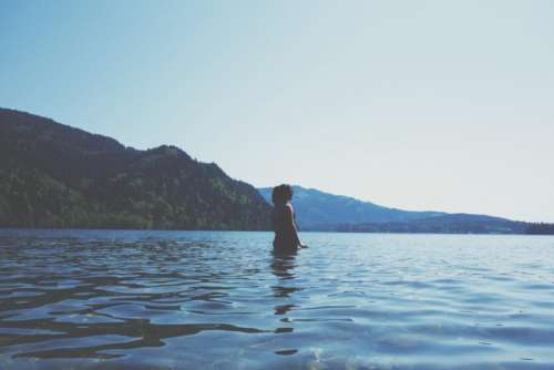girl woman lake water mountains