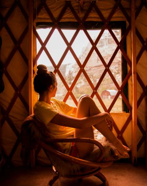 woman window warm snow indoors