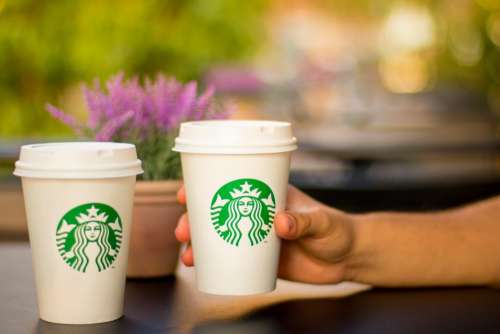 starbucks coffee cup hand